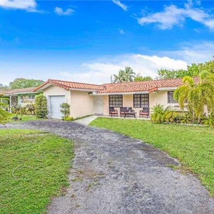 Buy this 4 bed house on 1061 Redbird Avenue in Miami Springs, FL 33166