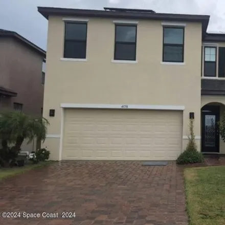 Rent this 4 bed house on 4158 Alligator Flag Cir in West Melbourne, Florida