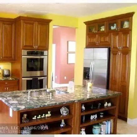 Buy this 4 bed house on Northwest 49th Court in Coconut Creek, FL 33073