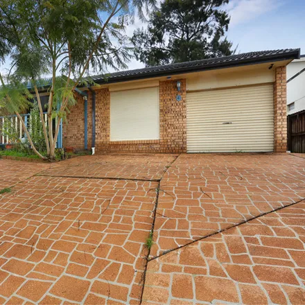 Buy this 6 bed house on Lillyvicks Crescent in Ambarvale NSW 2560, Australia