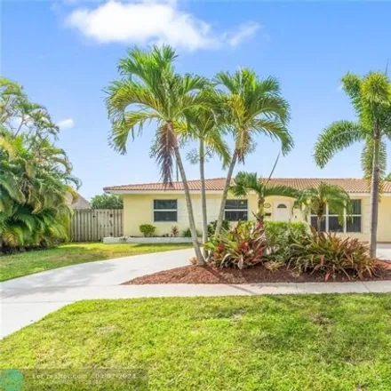 Buy this 4 bed house on 4448 Northwest 10th Street in Coconut Creek Park, Coconut Creek
