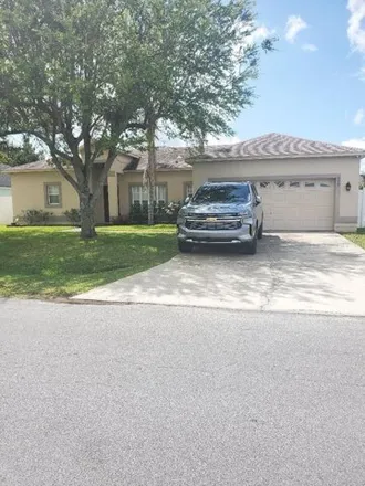 Rent this 4 bed house on 615 Baldwin Drive in Poinciana, FL 34758
