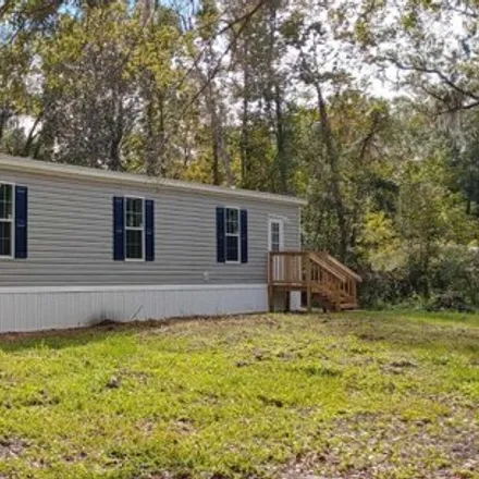 Buy this studio apartment on 211 Knight Boxx Rd in Middleburg, Florida