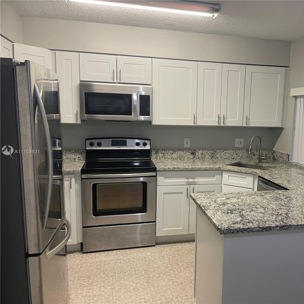 Rent this 2 bed condo on 4513 Treehouse Lane in Tamarac, FL 33319