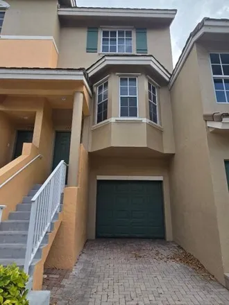 Rent this 3 bed house on Northeast 6th Street in Boynton Beach, FL