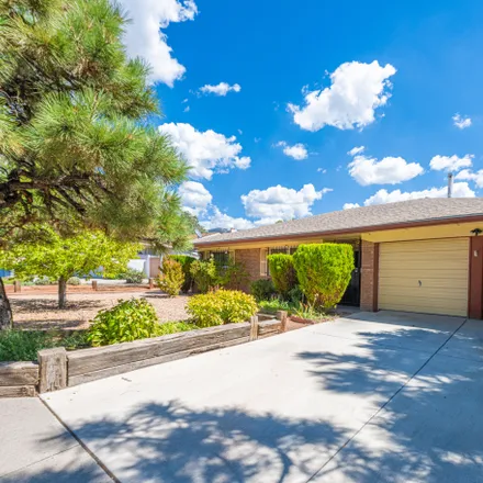 Buy this 3 bed house on 3312 Candlelight Drive Northeast in Matheson Park, Albuquerque