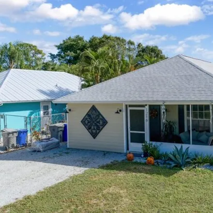 Buy this 4 bed house on 1220 19th Avenue Southwest in Florida Ridge, FL 32962