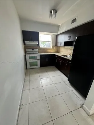 Rent this 2 bed house on 1445 West 28th Street in Strawberry Village Trailer Park, Hialeah