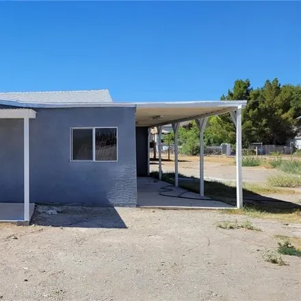 Buy this 3 bed house on 1111 Heritage Drive in Pahrump, NV 89048