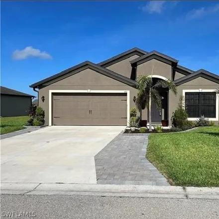Rent this 4 bed house on 148 Shadow Lakes Drive in Lehigh Acres, FL 33974