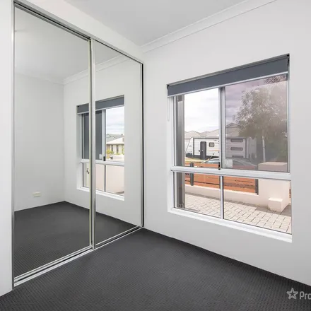 Rent this 3 bed apartment on Roatary Lane in Alkimos WA 6041, Australia