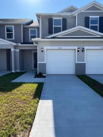Rent this 3 bed townhouse on 9347 Westside Hills Dr in Davenport, Florida