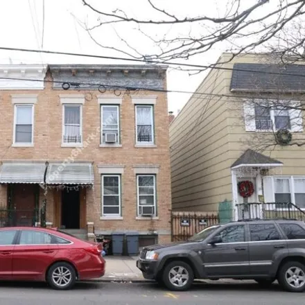 Buy this 5 bed house on 1916 Himrod Street in New York, NY 11385