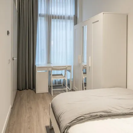 Rent this 3 bed room on Monet Garden Hotel in Valkenburgerstraat, 1011 NB Amsterdam
