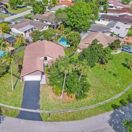 Buy this 4 bed house on 2311 Northwest 122nd Drive in Coral Springs, FL 33065