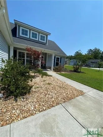 Rent this 4 bed house on 132 Whitaker Way North in Richmond Hill, GA 31324
