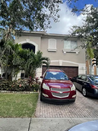 Buy this 4 bed loft on 699 South Alice Court in Palm Beach Farms, Palm Beach County