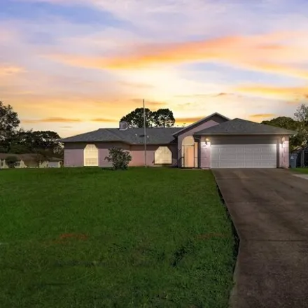 Buy this 3 bed house on 1123 Carthage Avenue Northwest in Palm Bay, FL 32907