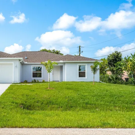Buy this 4 bed house on 1400 Waco Boulevard Southeast in Palm Bay, FL 32909