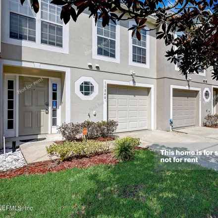 Buy this 3 bed townhouse on 11840 Lake Bend Circle in Jacksonville, FL 32218