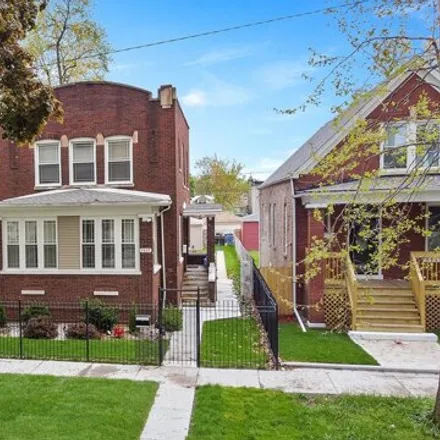 Buy this 3 bed house on 7435 South Michigan Avenue in Chicago, IL 60621