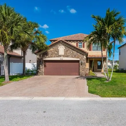 Buy this 5 bed house on 7220 Sandgrace Lane in Palm Beach County, FL 33463