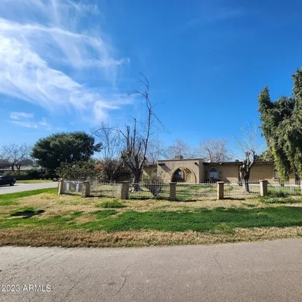 Rent this 4 bed house on 802 N Alzora Way in Tolleson, Arizona