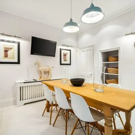 Rent this 3 bed townhouse on The White House in 4 Hans Crescent, London