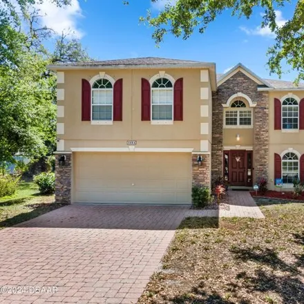 Buy this 4 bed house on 3884 Sunset Cove Dr in Port Orange, Florida