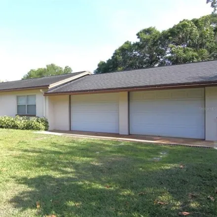 Rent this 4 bed house on 4306 Roush Avenue in Orange County, FL 32803