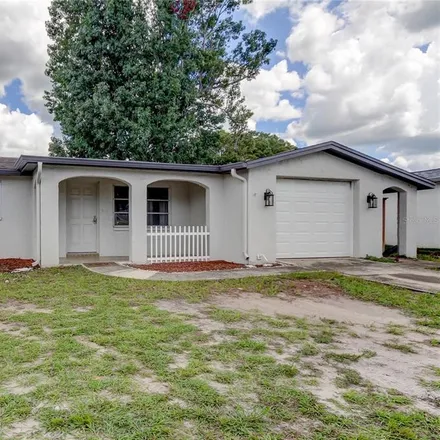 Buy this 3 bed house on 9118 Lunar Lane in Jasmine Estates, FL 34668