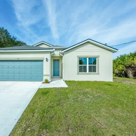 Buy this 4 bed house on 511 Lambright Street Southwest in Palm Bay, FL 32908