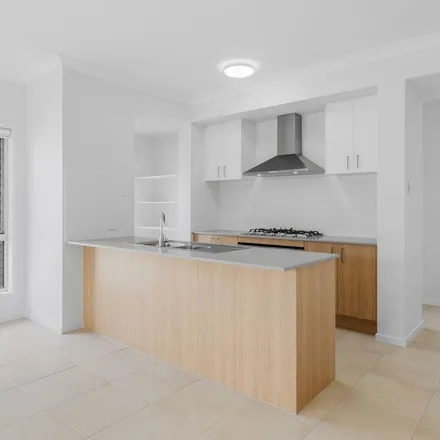 Rent this 4 bed apartment on Flaxton Drive in Yarrabilba QLD, Australia