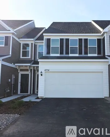 Rent this 3 bed townhouse on 4774 Airlake Curve