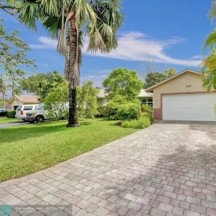 Buy this 3 bed house on 1317 Northwest 87th Avenue in Coral Springs, FL 33071