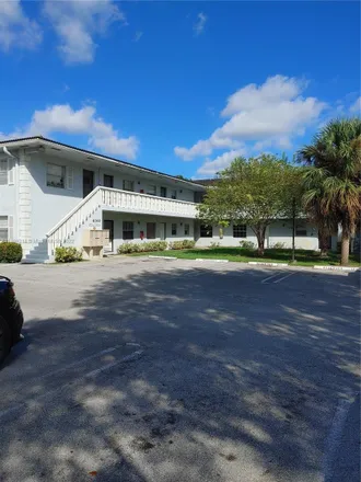 Rent this 2 bed condo on Woodside Drive in Coral Springs, FL 33065