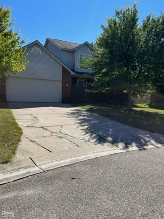 Buy this 3 bed house on 1021 Tartan Lane in Commerce Township, MI 48390