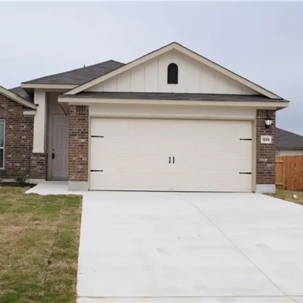Rent this 4 bed house on 1689 Woodlands Dr in Kyle, Texas