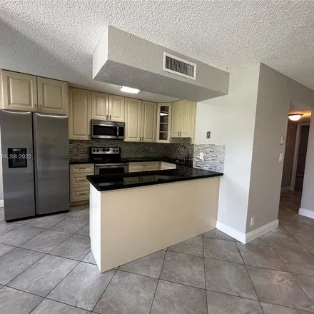 Rent this 2 bed apartment on 5547 Courtyard Drive in Margate, FL 33063
