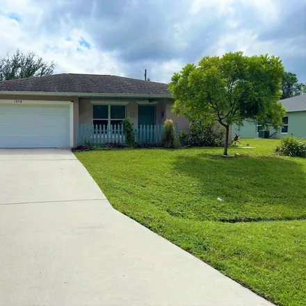 Rent this 3 bed house on 1470 Southwest Gadsan Avenue in Port Saint Lucie, FL 34953
