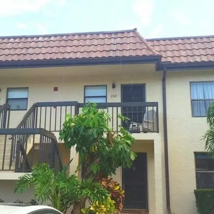 Rent this 2 bed condo on 7101 Golf Colony Ct Apt 102 in Lake Worth, Florida