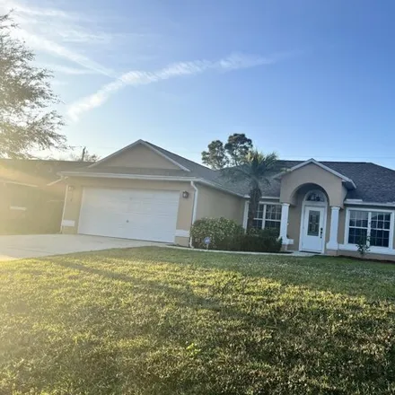 Rent this 3 bed house on 178 Southwest Sea Lion Road in Port Saint Lucie, FL 34953