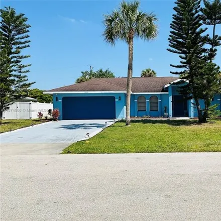 Buy this 3 bed house on 1837 Northeast 1st Terrace in Cape Coral, FL 33909