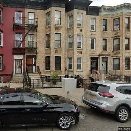 Buy this 6 bed townhouse on 1849 Park Place in New York, NY 11233