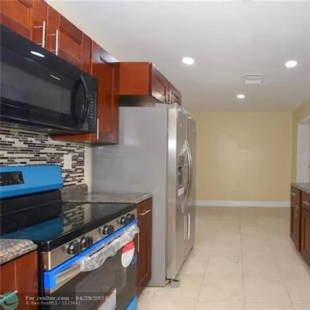 Buy this 4 bed house on 6152 Northwest 42nd Terrace in Pompano Park, North Lauderdale