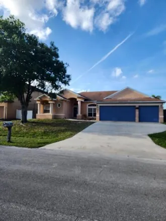 Buy this 4 bed house on 4409 Southwest Fireside Circle in Port Saint Lucie, FL 34953