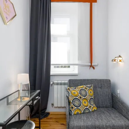 Rent this 4 bed room on Henryka Siemiradzkiego 10a in 60-763 Poznań, Poland