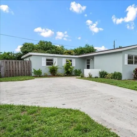 Buy this 4 bed house on 1090 W Woodcrest Rd in West Palm Beach, Florida