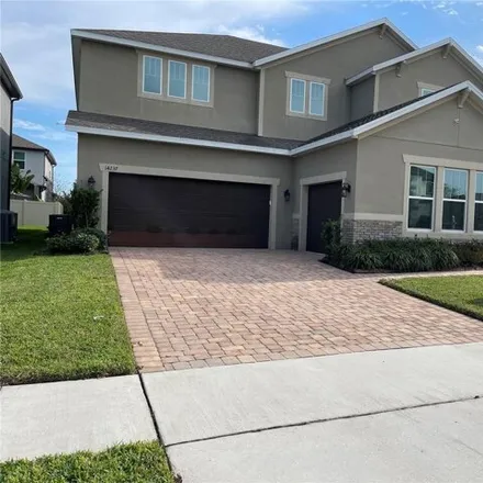 Rent this 5 bed house on 14235 Woodchip Drive in Orange County, FL 32824