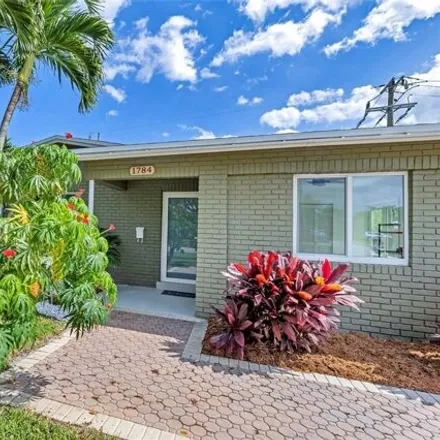 Buy this 4 bed house on 3882 Northwest 18th Avenue in Royal Palm Isles, Broward County